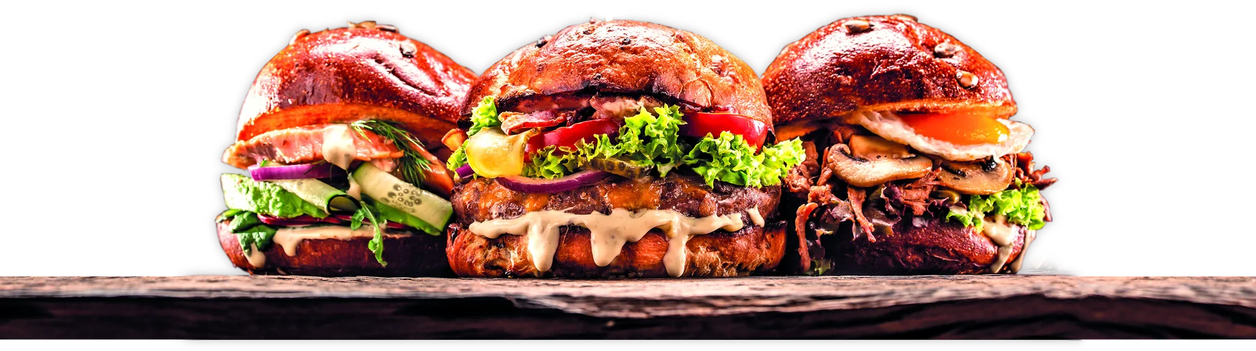Three Hall of Fame signature burgers on a wooden board
